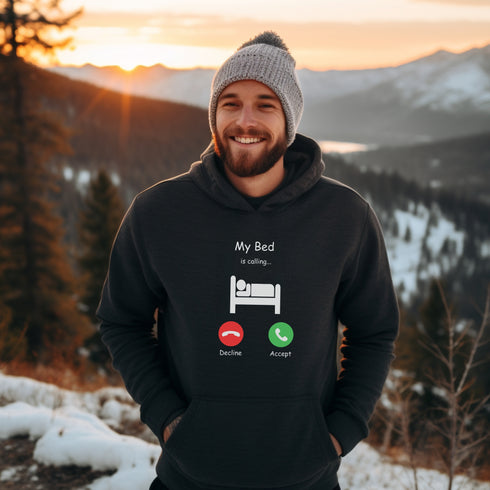 Introducing the ultimate hoodie for all those who love their bed more than anything else - the My Bed Is Calling hoodie! Featuring a hilarious stick figure lying in bed, this sweater is the perfect way to show off your love for all things cozy and comfortable.